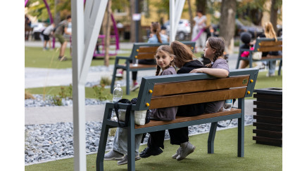 Bench with a back on metal legs